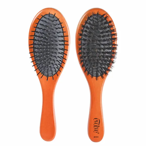 La brosse à cheveux double face Evolve® : un coté en poils de sanglier naturel 100% pur, un coté avec picots en nylon.