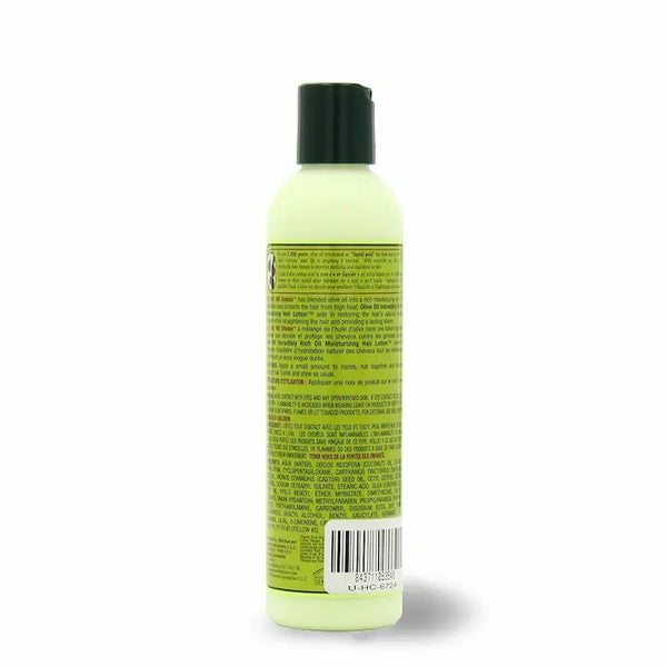 Lotion Coiffante Olive Oil d'ORS composée d'un mélange d'huiles végétales qui protègent les cheveux des dommages causés par la chaleur des outils de coiffage : sèche cheveux, fer, lisseur.