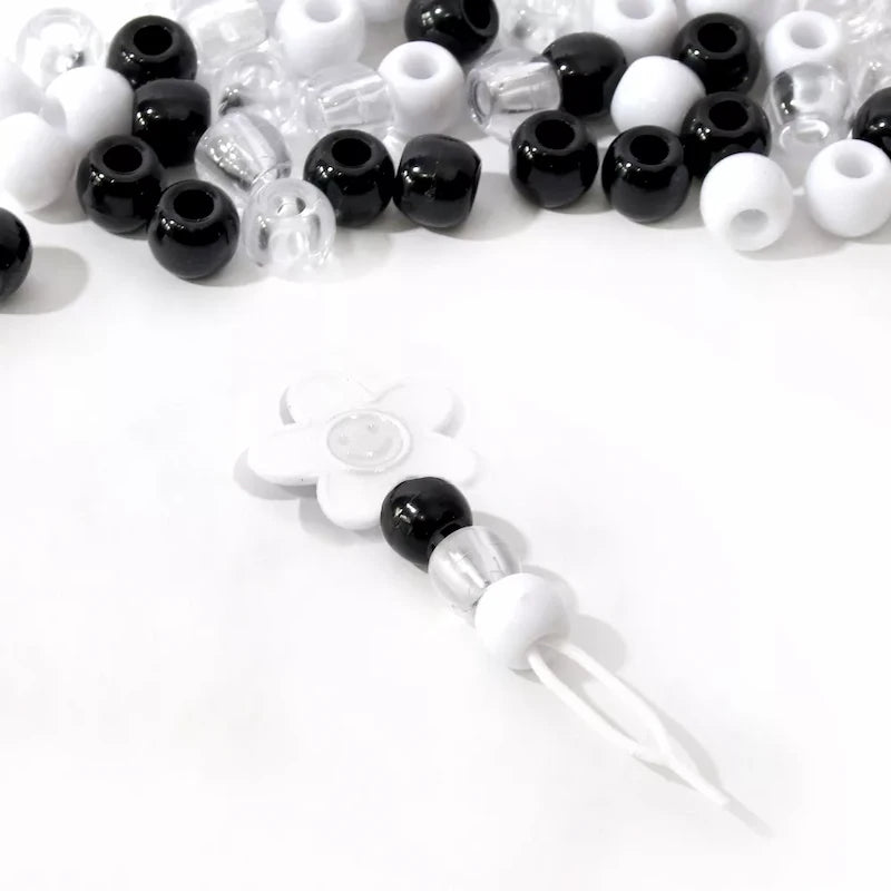 Perles cheveux noires blanches et transparentes